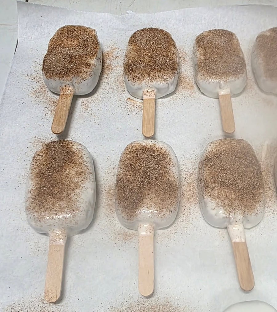 White cakesicles dusted with cinnamon sugar