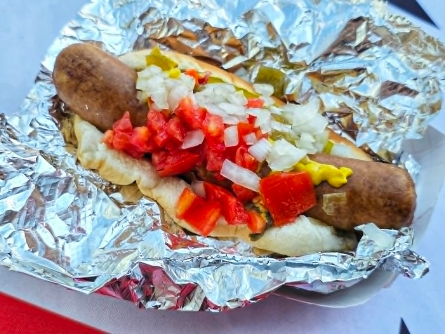 Chicago style hot dog with diced tomato, onion, relish, and mustard